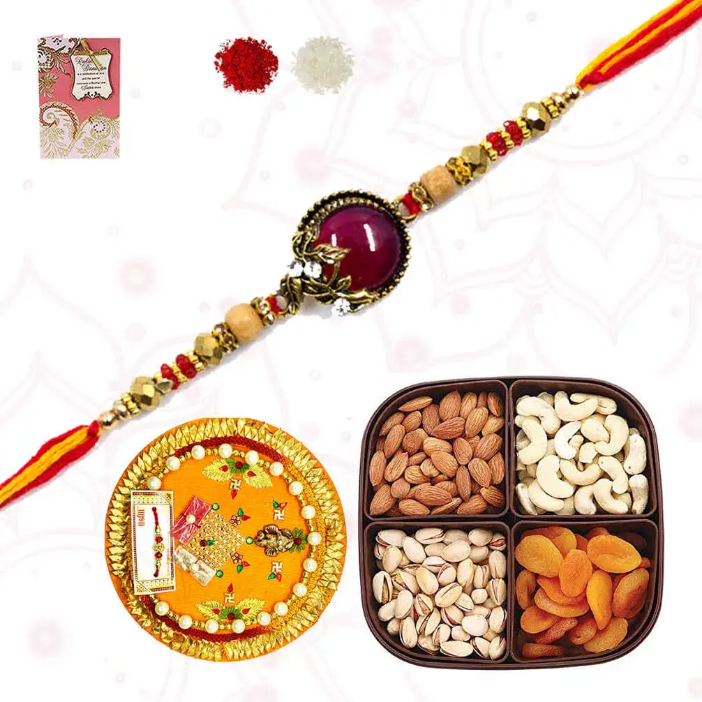 1 Fancy Rakhi with Dryfruits Platter consisiting of Cashew, raisins, almonds and Apricots with designer puja thali