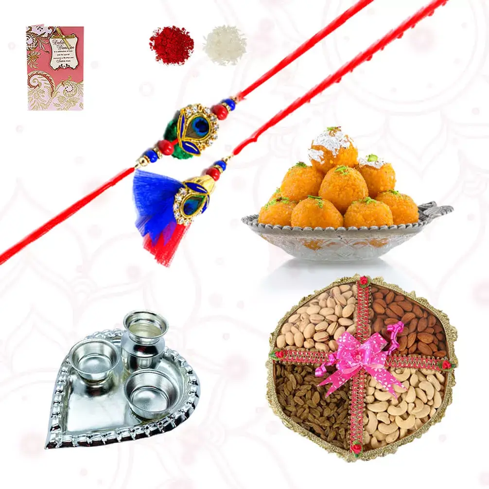 1bhaiya bhabhi rakhi set with Boondi Laddo and Dry fruits consisting of Raisin and Cashews with Heart shape silver plated special puja thali